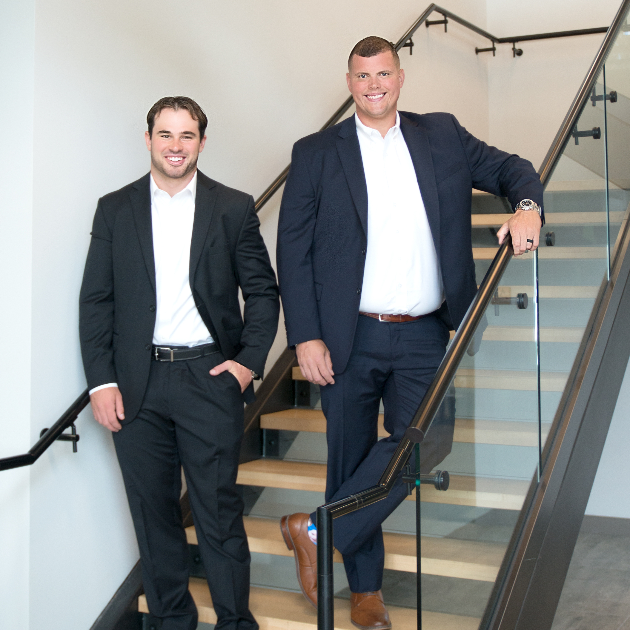 Belding Insurance Group advisors on office stairs